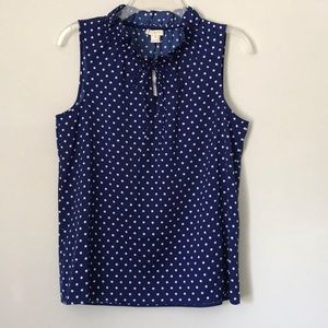 Navy and white polka dot sleeveless tank top.
